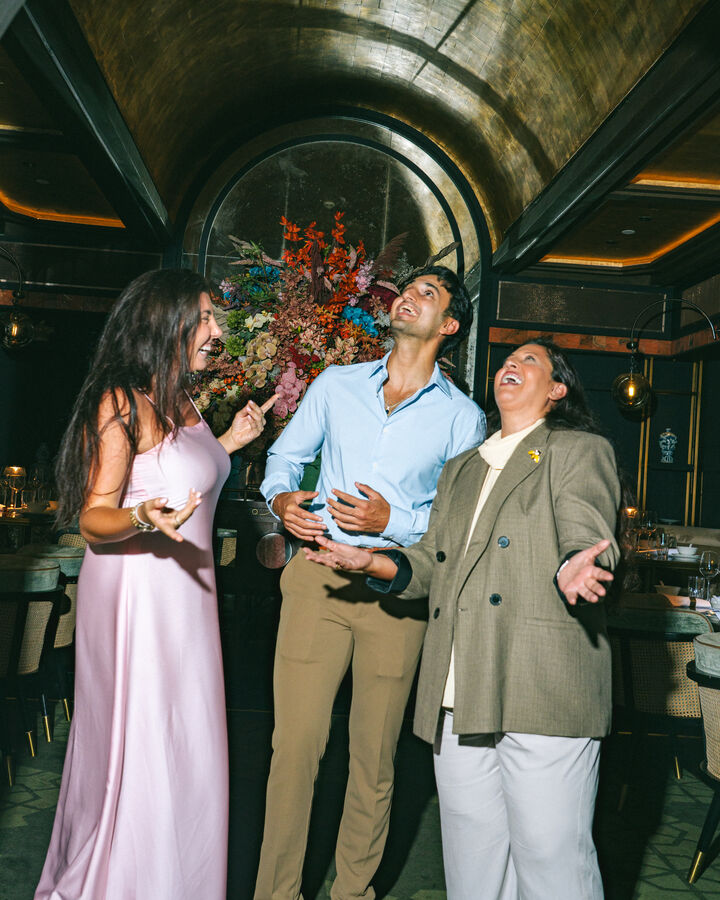 Three people sharing a laugh.